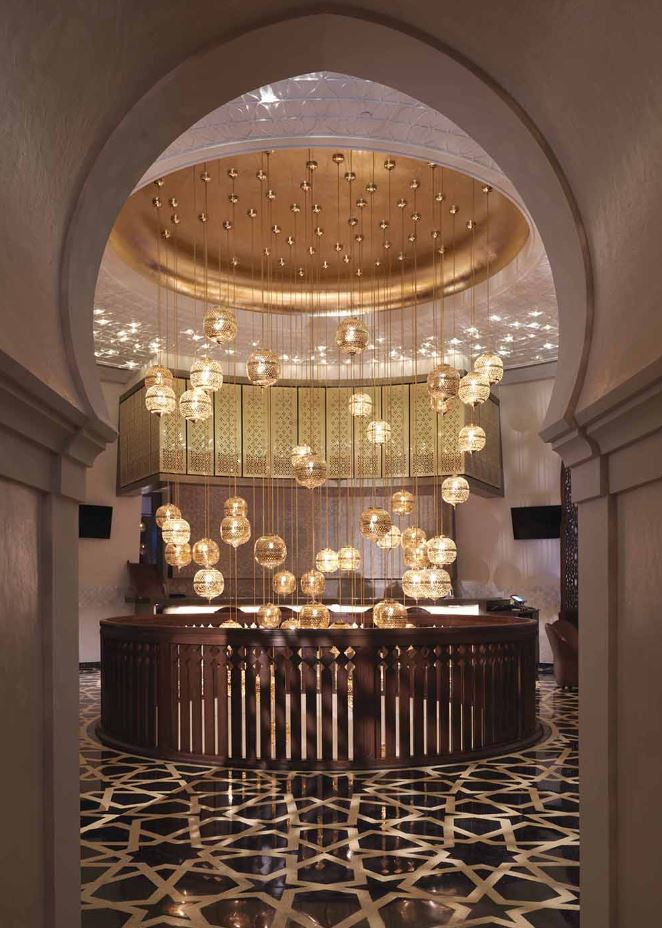 Moroccan Ceiling lights hanging in a hotel stairwell in Qatar - EDKEN LIGHTING