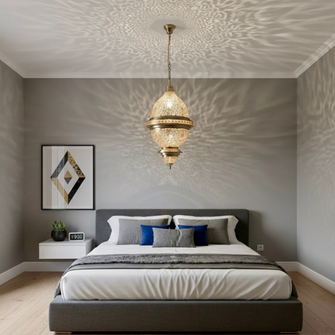 Symmetrical view of a Moroccan brass pendant light between two walls with dramatic shadow effects.
