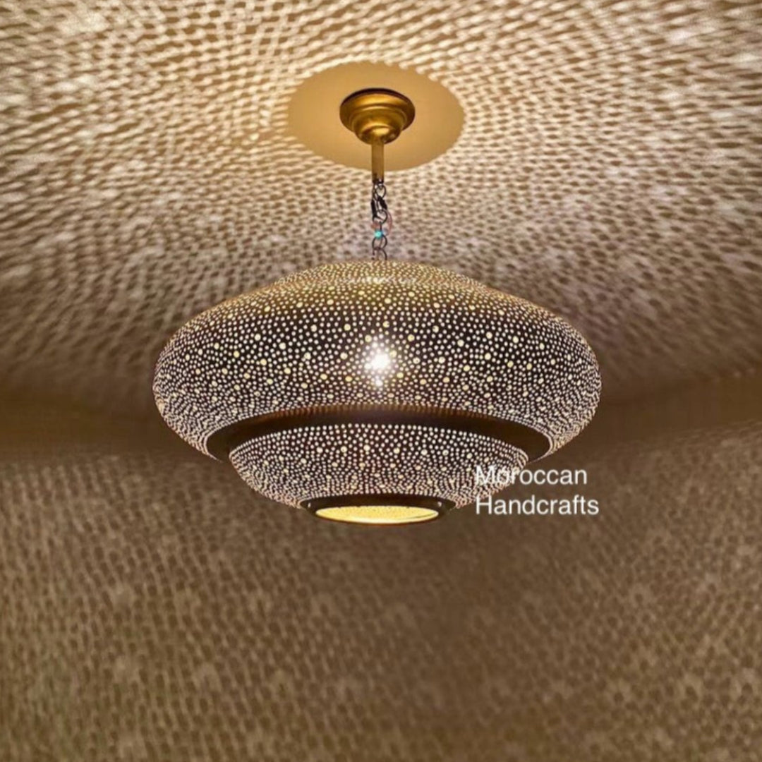 Authentic Moroccan brass lighting fixture with a warm gold finish for home decor.