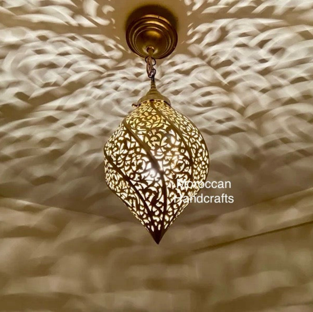 Small, artisan-made Moroccan lamp that creates a unique and warm ambient light effect in a room.