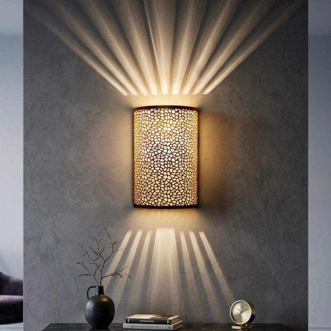 Contemporary living room interior featuring a Moroccan brass wall lamp above a wooden console, modern luxury home decor style.