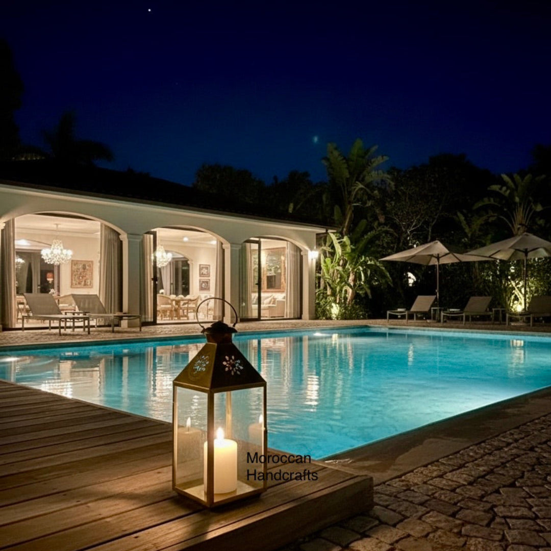 Authentic Moroccan artisanal candle holder crafted from brass, designed as a decorative house lantern, illuminating a dimly lit, upscale indoor space.