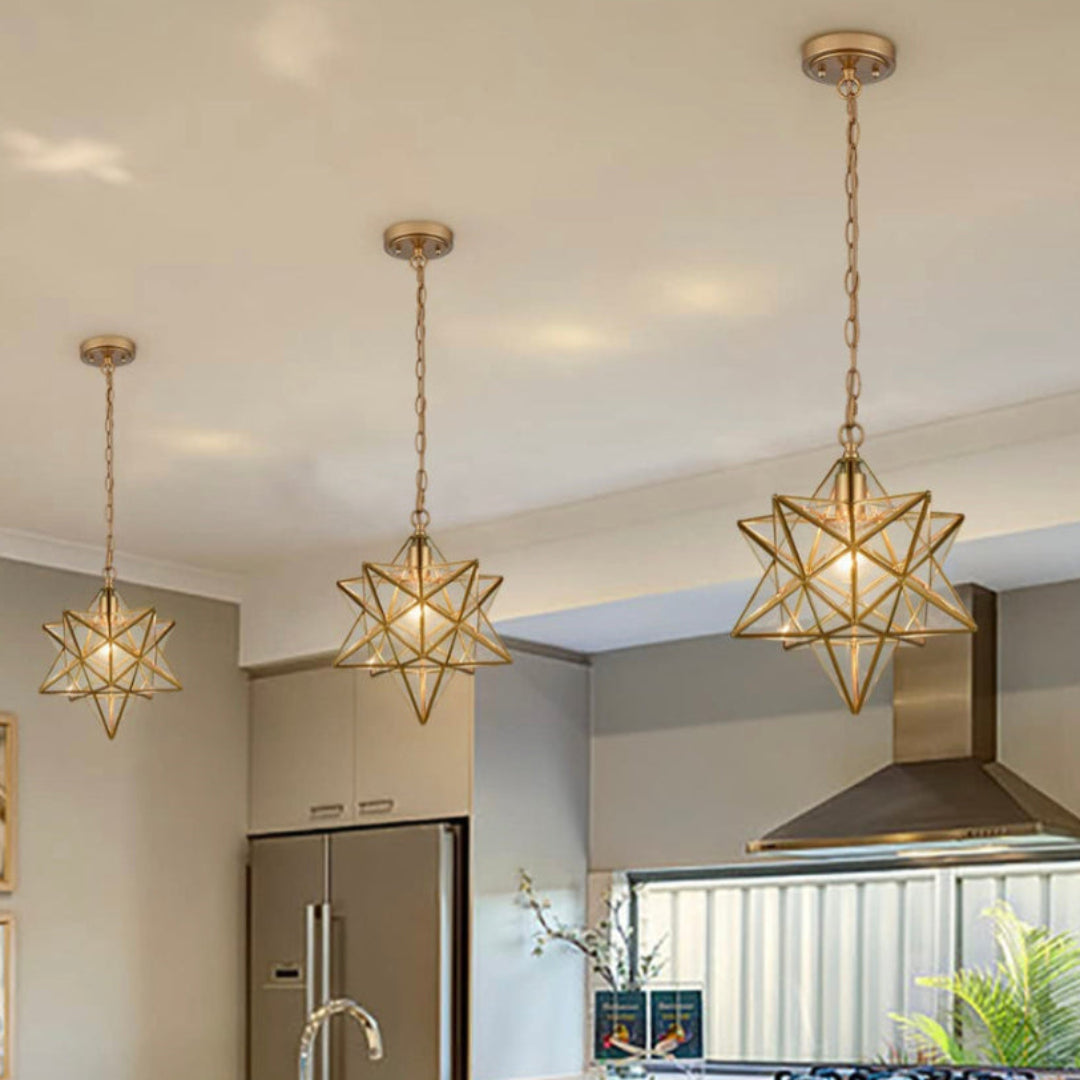 Close-up of a Moravian star lamp showing intricate brass brasswork and artisan craftsmanship.