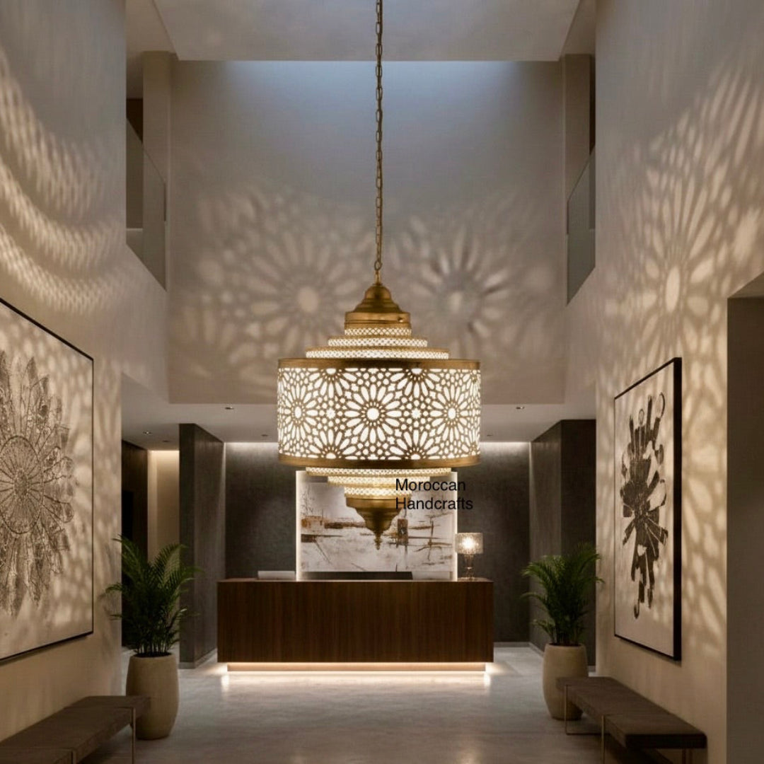 Close-up of hand-etched gold brass Moroccan lamp showing intricate artisanal craftsmanship.