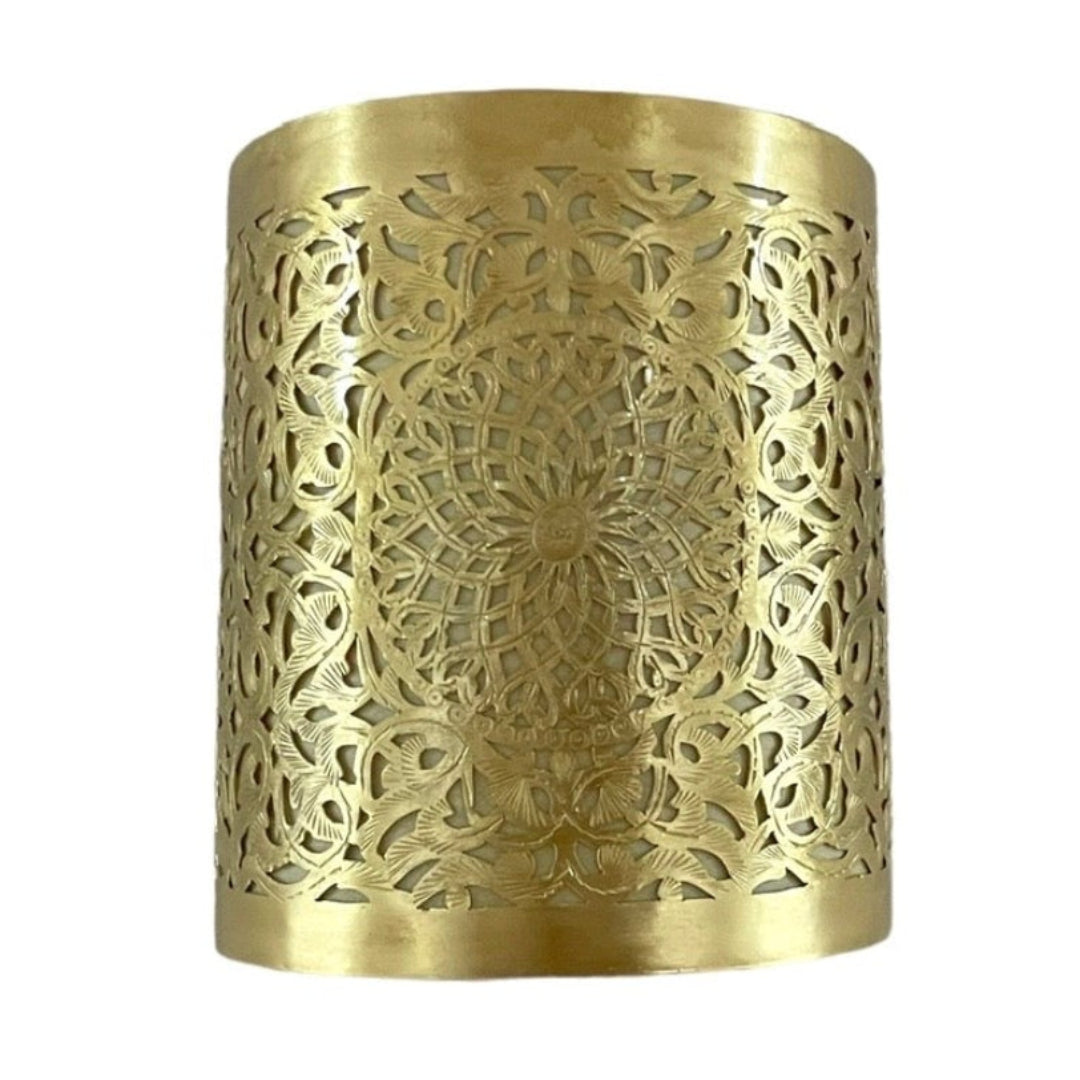Curved Moroccan brass wall lamp with intricate hand-pierced floral design.