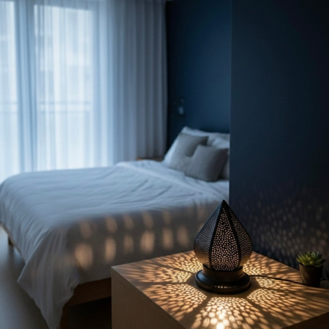 Detailed shot of a Moroccan handmade brass lamp with unique geometric light shadows.