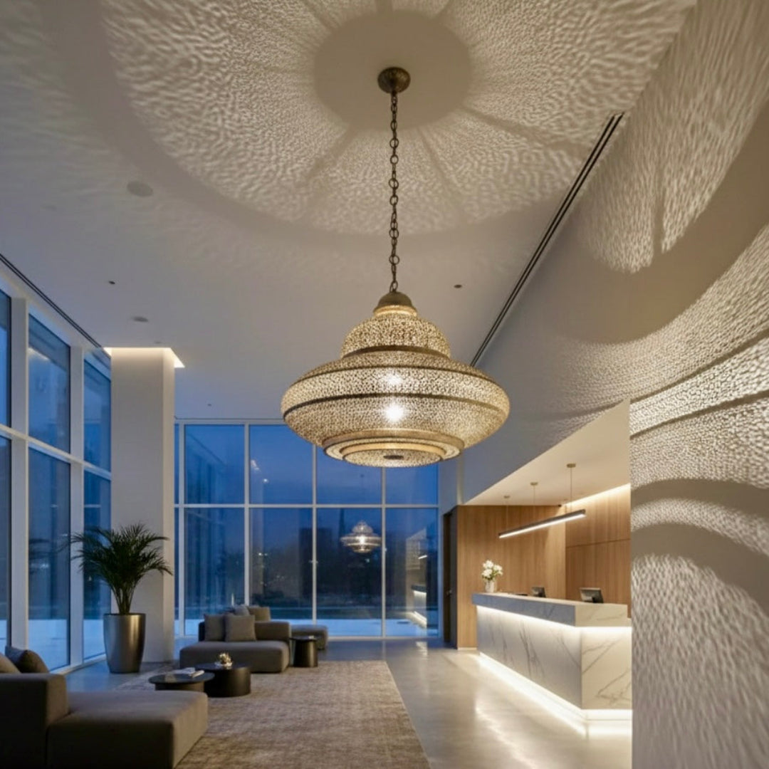 Elegant Moroccan handmade brass pendant lamp installed in a narrow upscale restaurant, creating a cozy atmosphere with warm shadow patterns.