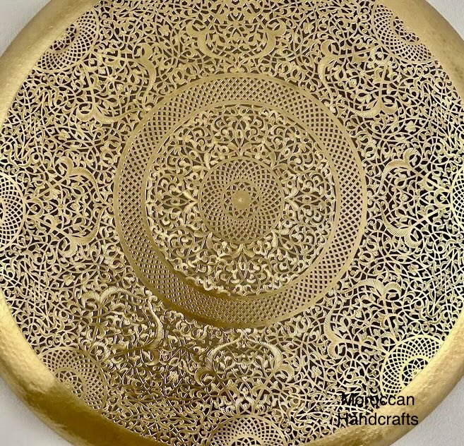 Handmade large Moroccan circular light fixture featuring a detailed mandala-like pattern in brass.