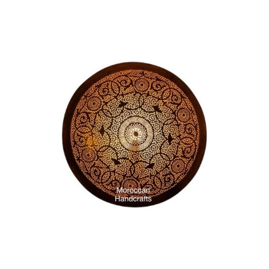 Handmade Moroccan brass ceiling light, round flush mount with intricate filigree geometric piercing and warm glow.