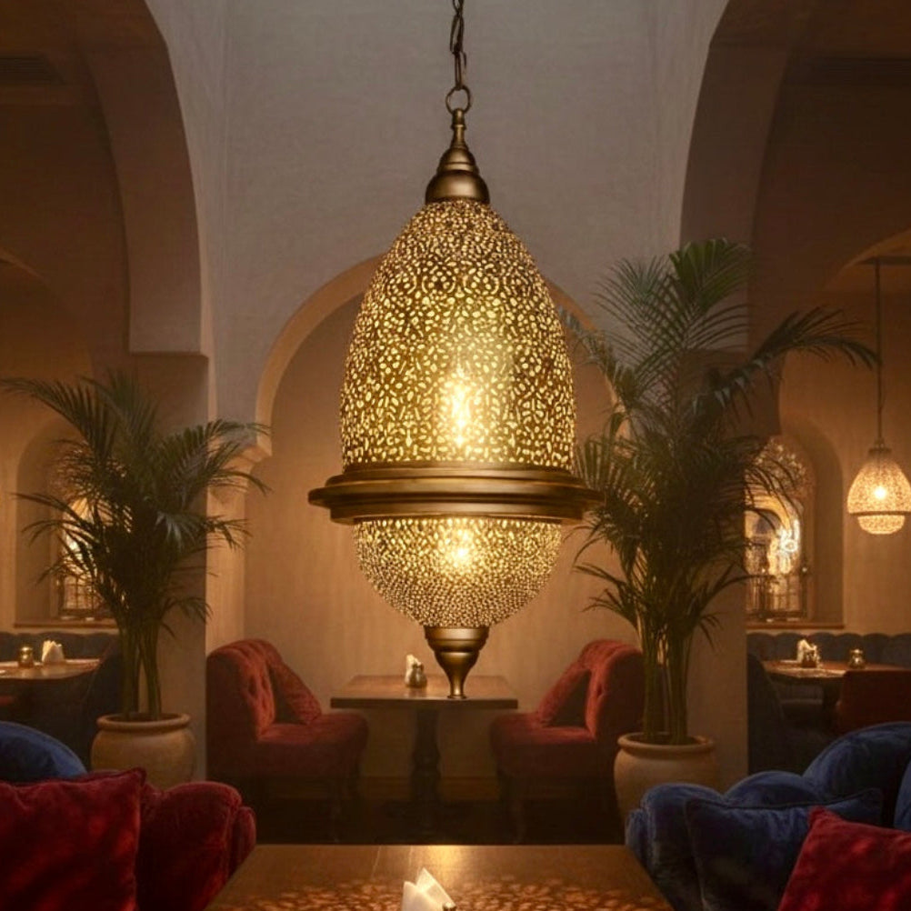 Handmade Moroccan brass lamp hanging in a modern bedroom, creating intricate shadow patterns on the walls.