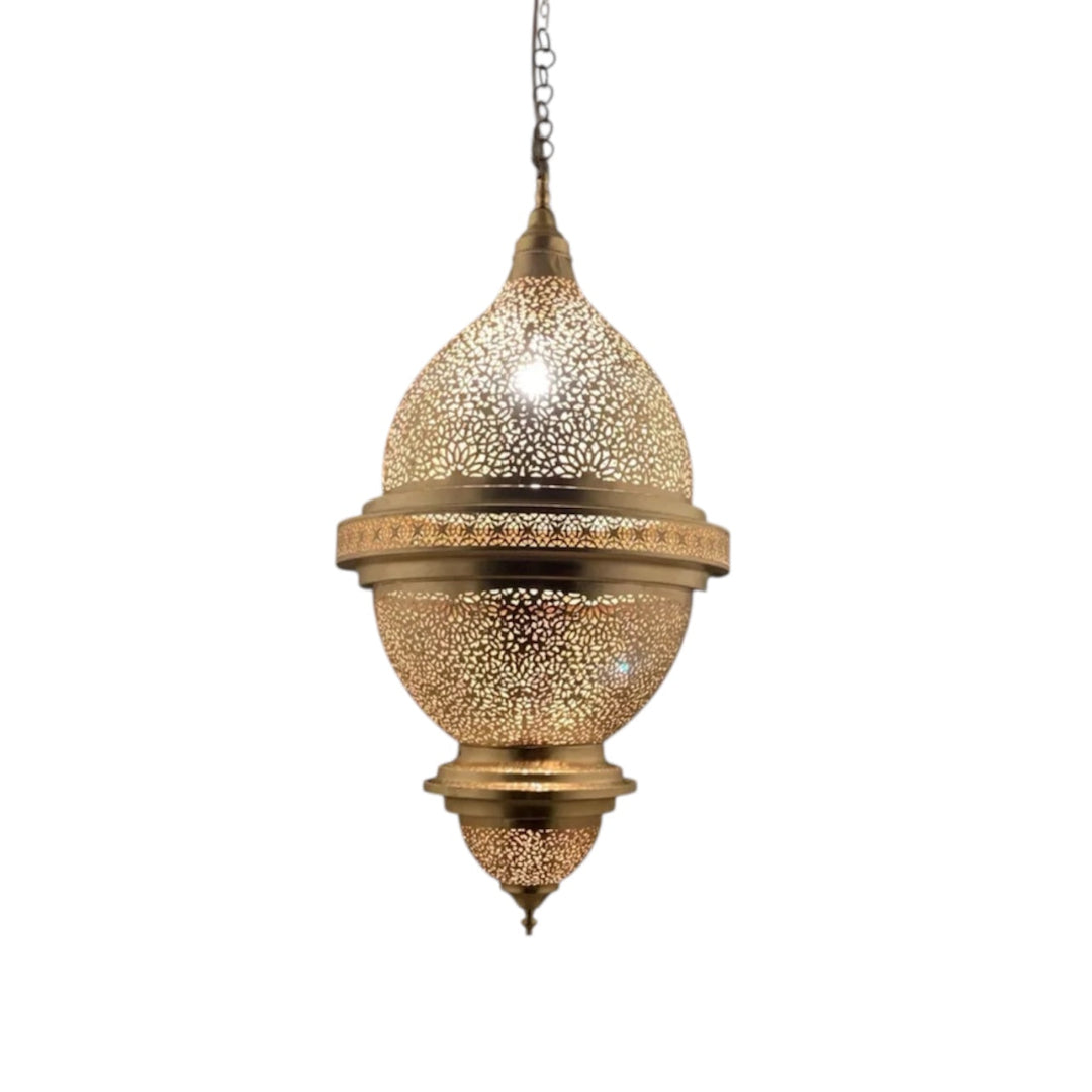 Large Moroccan brass pendant lamp casting intricate geometric shadows in a modern dining area.
