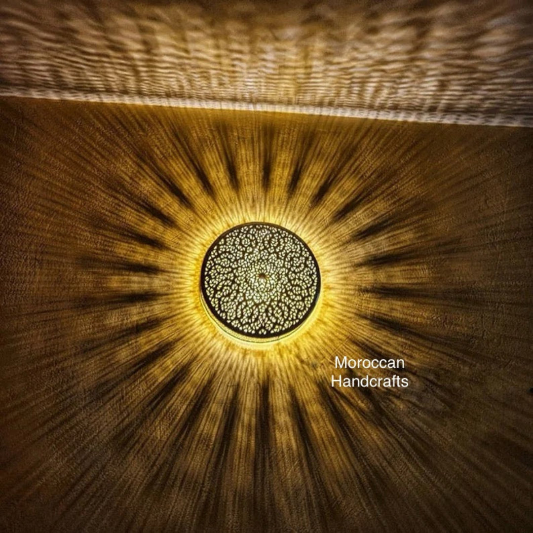 Unique handmade filigree brass wall lamp (sconce) creating stunning star and pattern shadows on the wall.