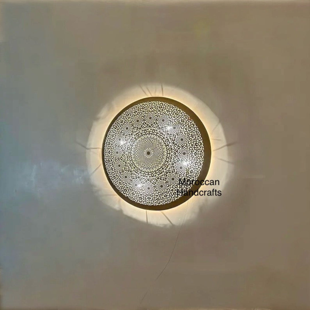 Side view of the solid brass Moroccan light fixture, showing the wall mount structure and antique finish detail.