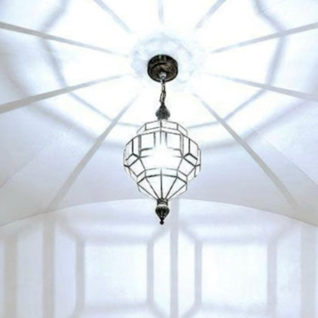 Moroccan brass ceiling light creating beautiful geometric shadows for ambient mood.