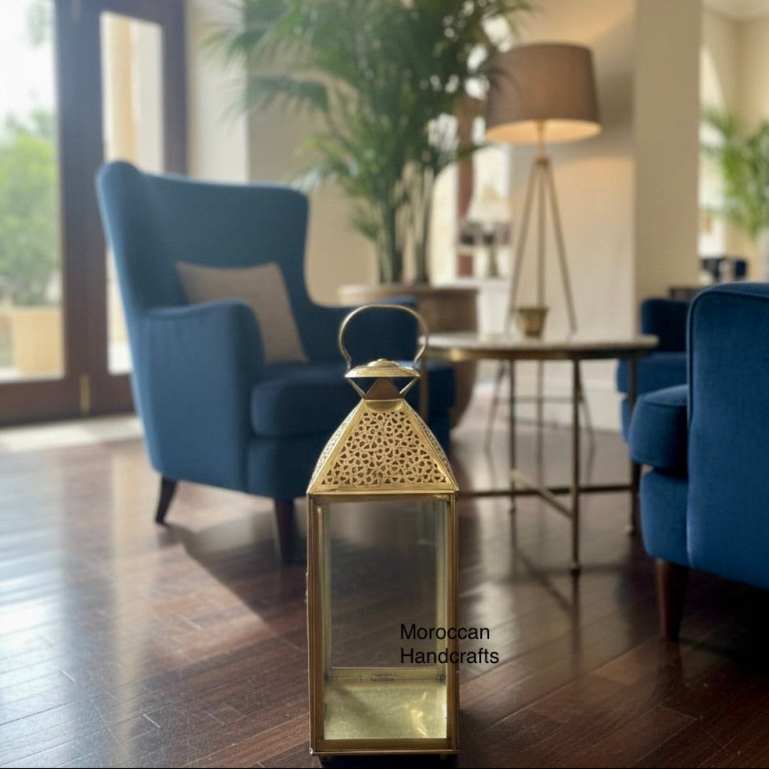Authentic Moroccan brass lamp with a ring handle and glass panels, perfect for luxury patio lighting or wedding centerpieces.