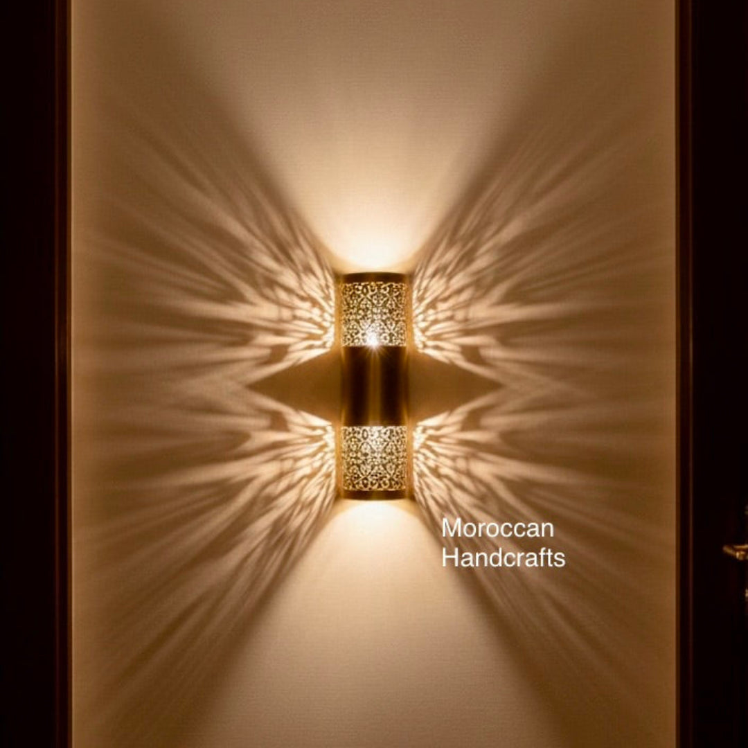 Decorative brass wall light in a Moroccan style creating exotic patterns and a cozy atmosphere in a luxury interior.