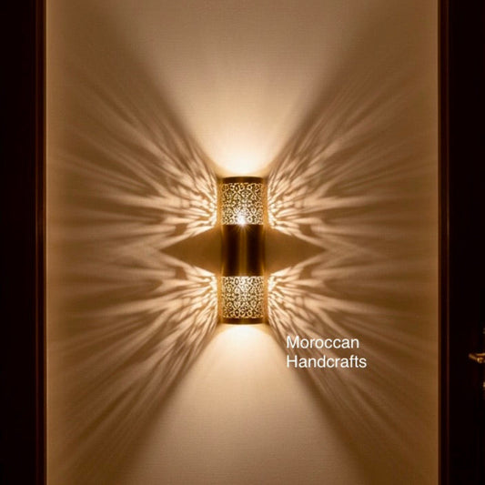 Decorative brass wall light in a Moroccan style creating exotic patterns and a cozy atmosphere in a luxury interior.