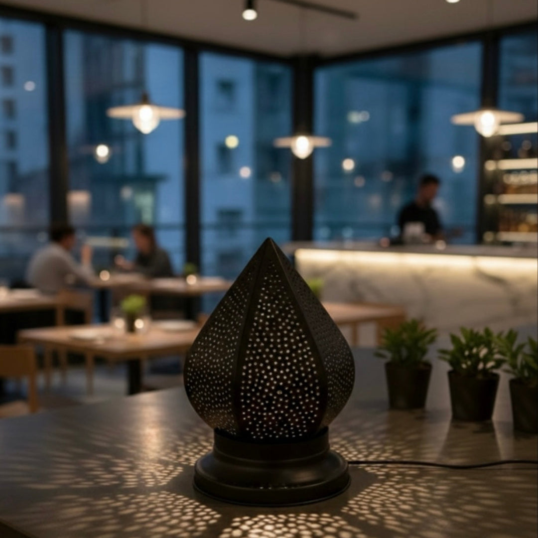 Traditional Moroccan brass lantern in a modern restaurant interior for an exotic atmosphere.