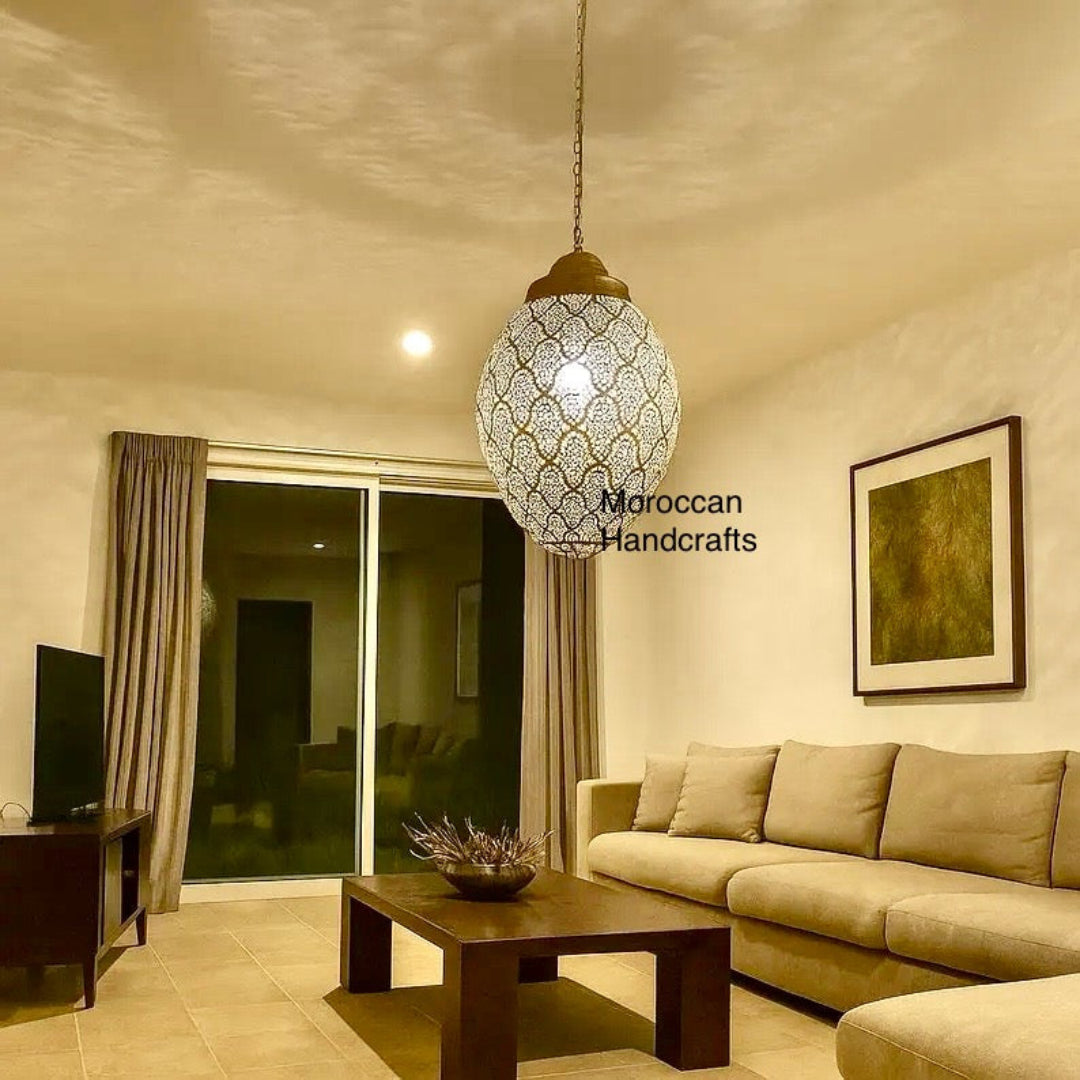 A six-pointed star-shaped Moroccan ceiling lantern made of perforated silver metal, ideal for creating a celestial light display