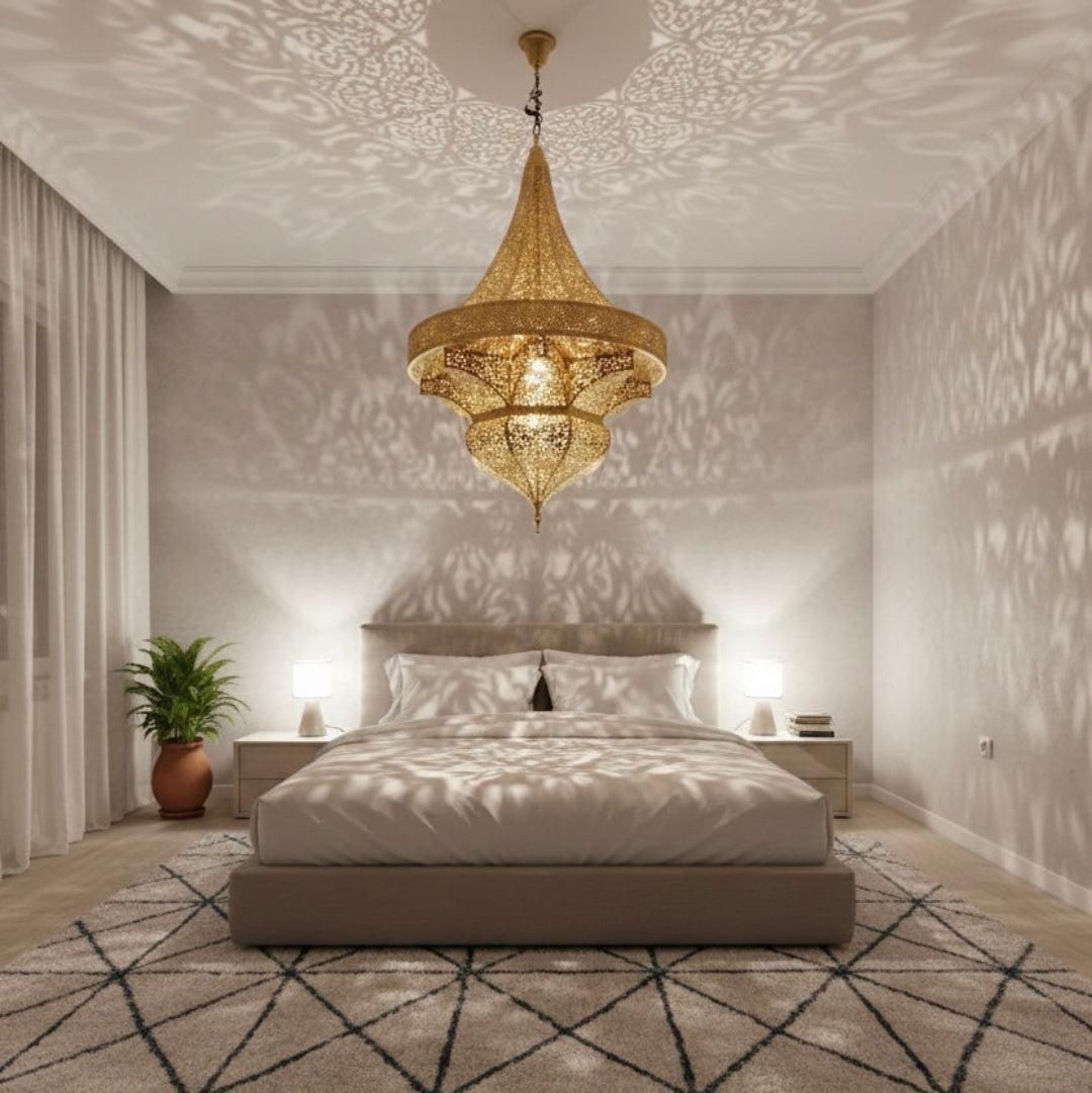  Oversized Moroccan statement ceiling lamp in an open-plan living room, showcasing artisanal brass finish and North African lighting style.