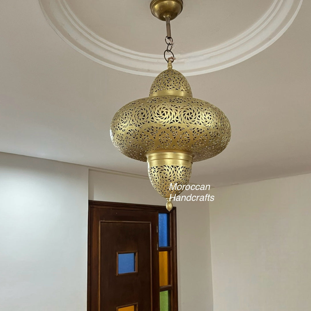 A freestanding, tall cylindrical Moroccan floor lamp made from antique copper, featuring finely perforated bands for ambient, vertical lighting.