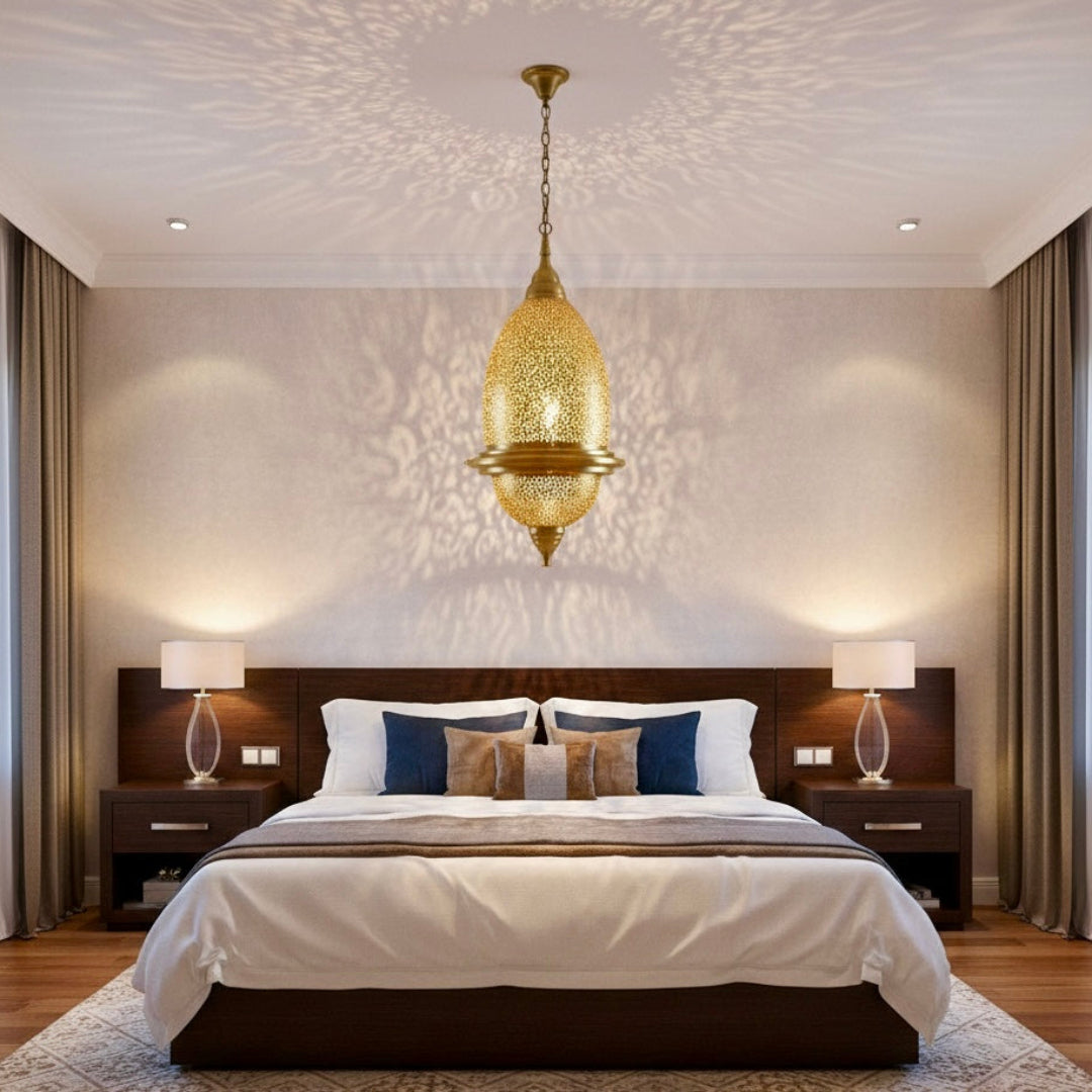 Close-up of a lit Moroccan brass lamp showing detailed hand-engraved patterns and warm golden glow