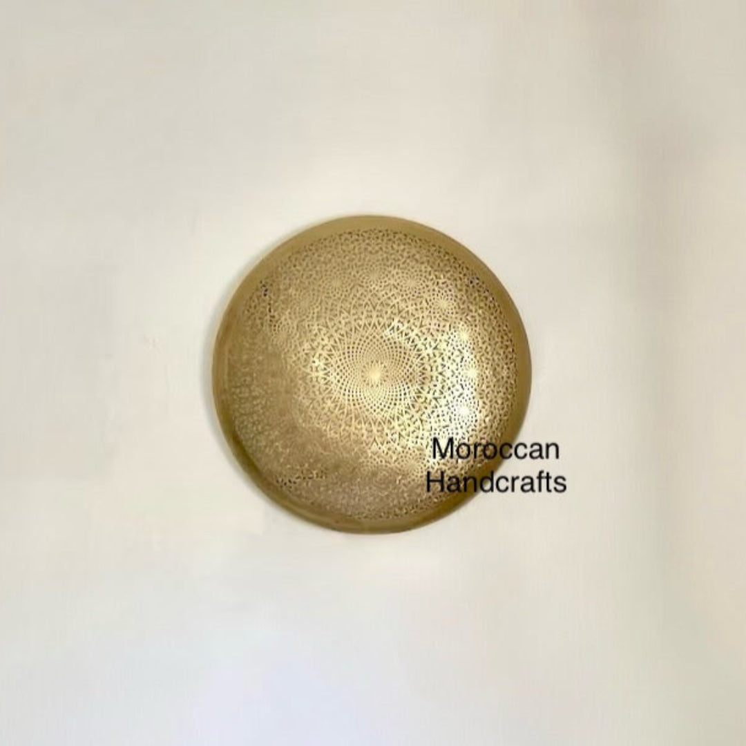 Detailed close-up of the hand-engraved brass filigree on the Moroccan lamp, showing the traditional artisanal craftsmanship.