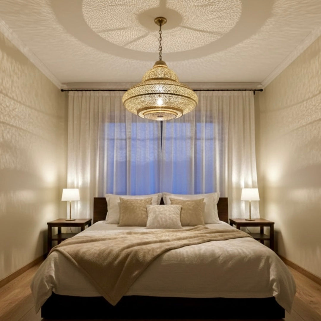 Close-up of a Moroccan brass pendant light featuring hand-pierced floral and geometric patterns, ideal for bohemian home interior design.