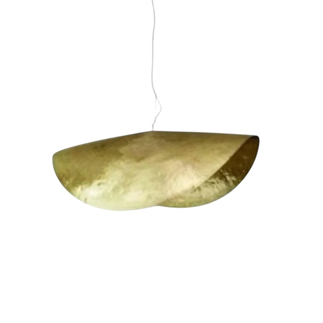 Ambient lighting effect of a Moroccan brass lamp at night, creating a warm and sophisticated atmosphere in a luxury interior.