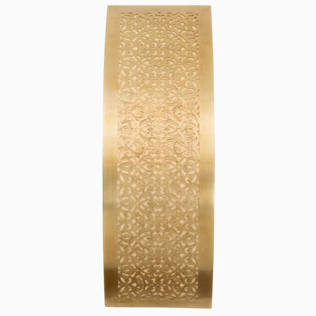 A handcrafted antique brass Moroccan wall sconce with detailed metalwork on a plain white background.