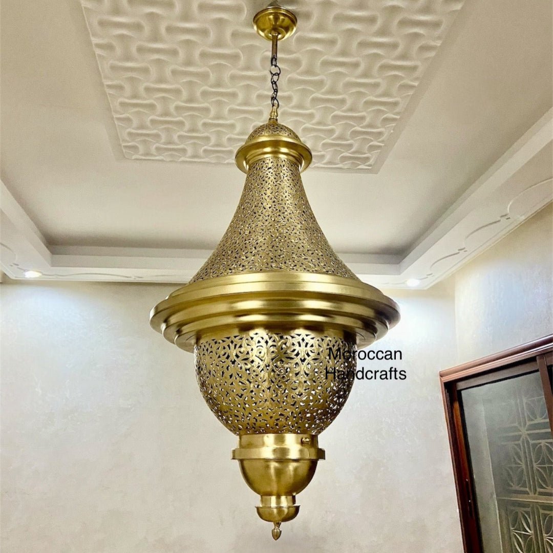 Hand-punched Arabian lantern chandelier with ornate filigree design, hanging from the ceiling.
