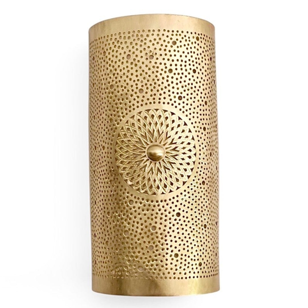 A single handmade Moroccan brass wall lamp with a brushed gold finish and intricate hand-punched filigree design against a white background.