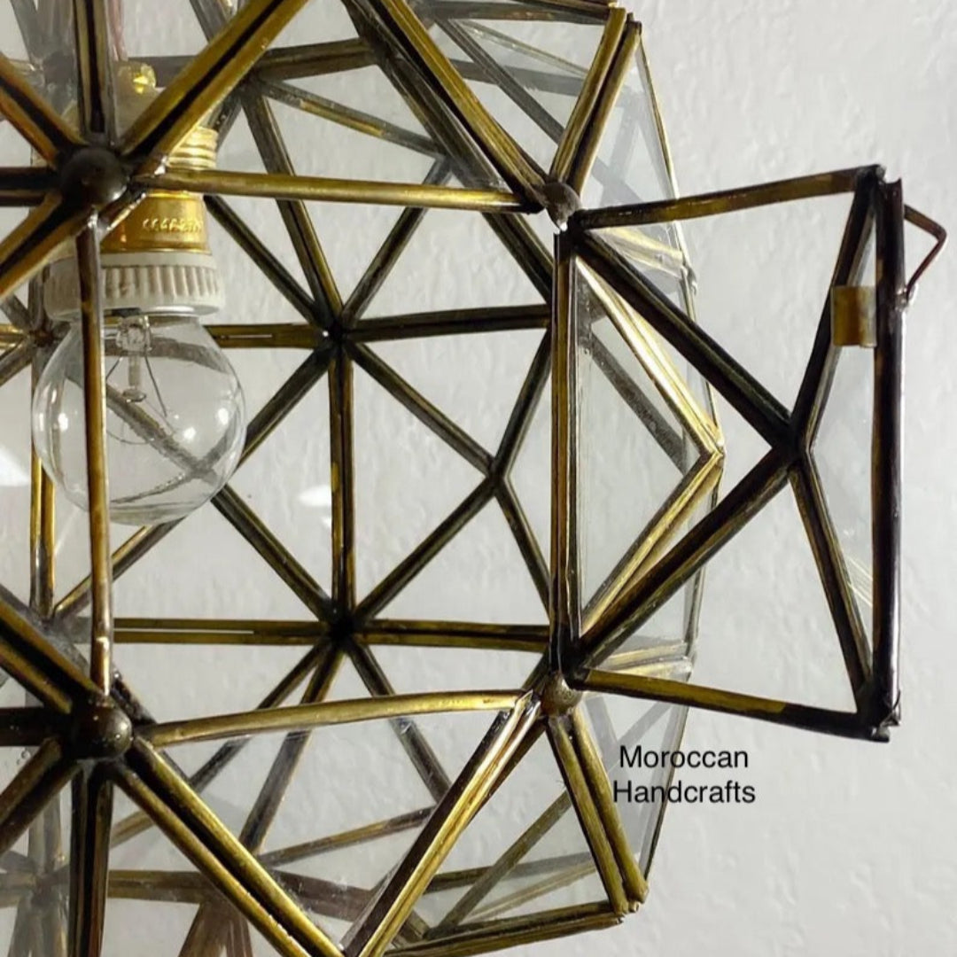 Artisanal Moroccan brass hanging lamp with traditional hand-cut metalwork for luxury home decor.