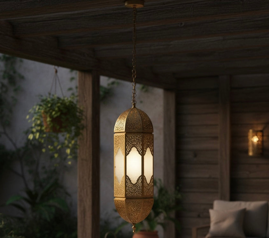 Authentic Moroccan brass pendant light glowing softly in a cozy outdoor patio setting.