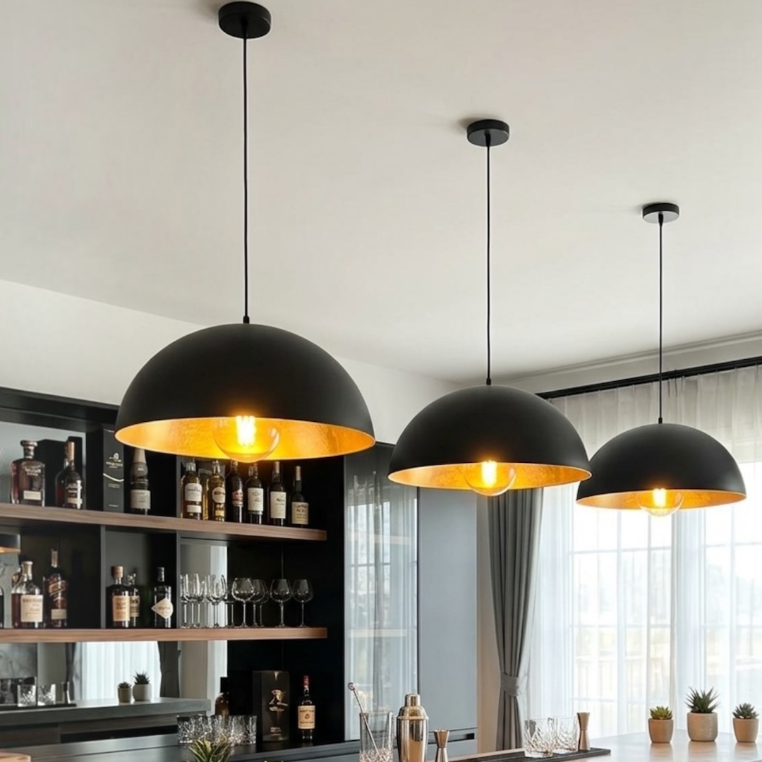 Trio of matte black and brass Moroccan dome light fixtures illuminate a custom home bar counter.
