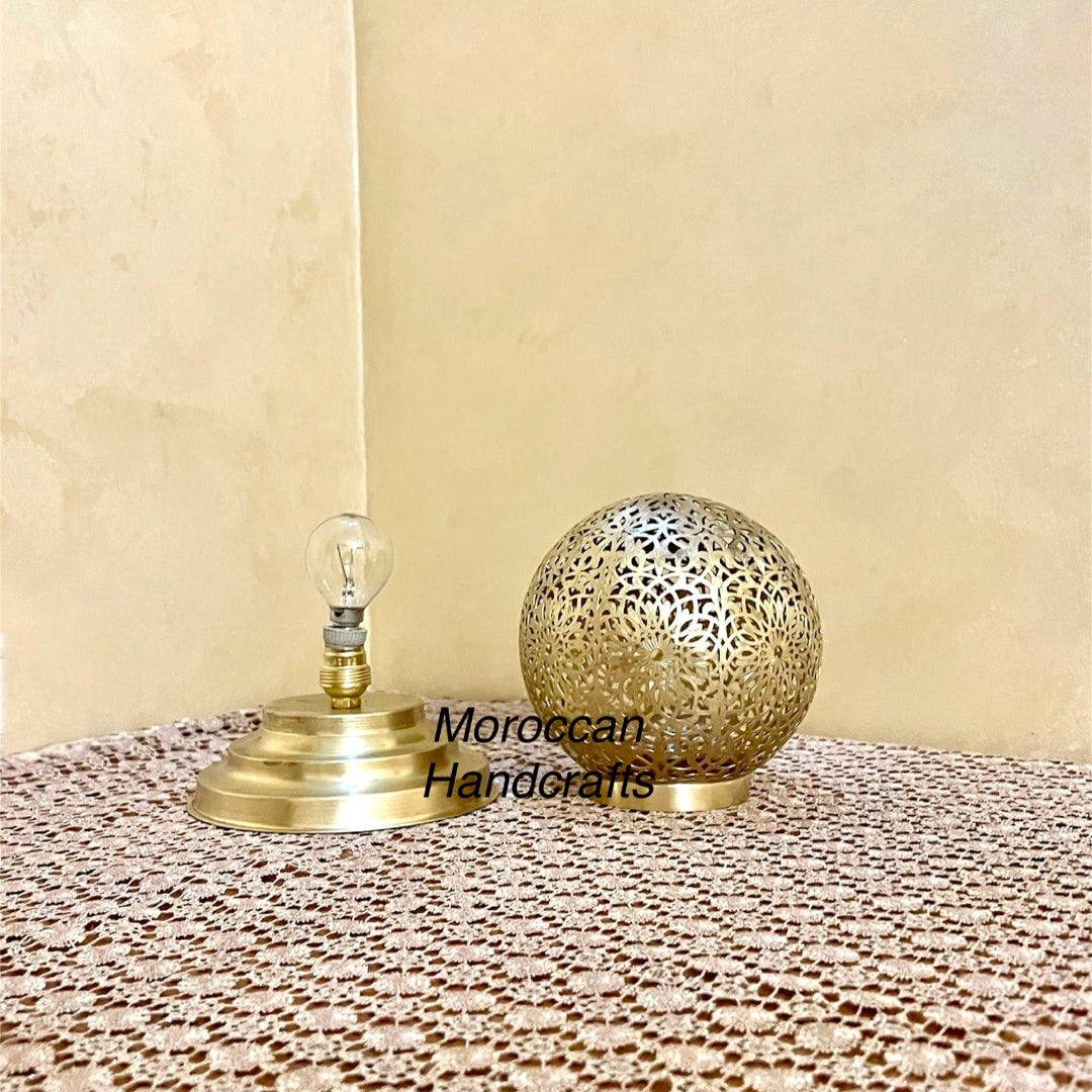 Bohemian-style accent lighting from a handcrafted Moroccan sphere lamp, adding warmth to home decor.