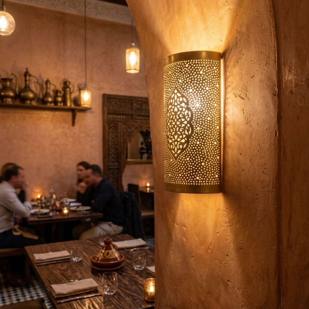  Atmospheric restaurant interior decorated with handmade Moroccan brass sconces providing warm ambient lighting.