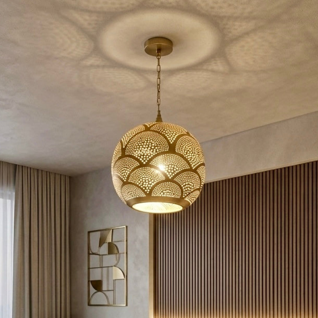  A warm and cozy bedroom with a wood slat headboard illuminated by a Moroccan brass sphere lamp, creating a relaxing atmosphere with soft shadow play