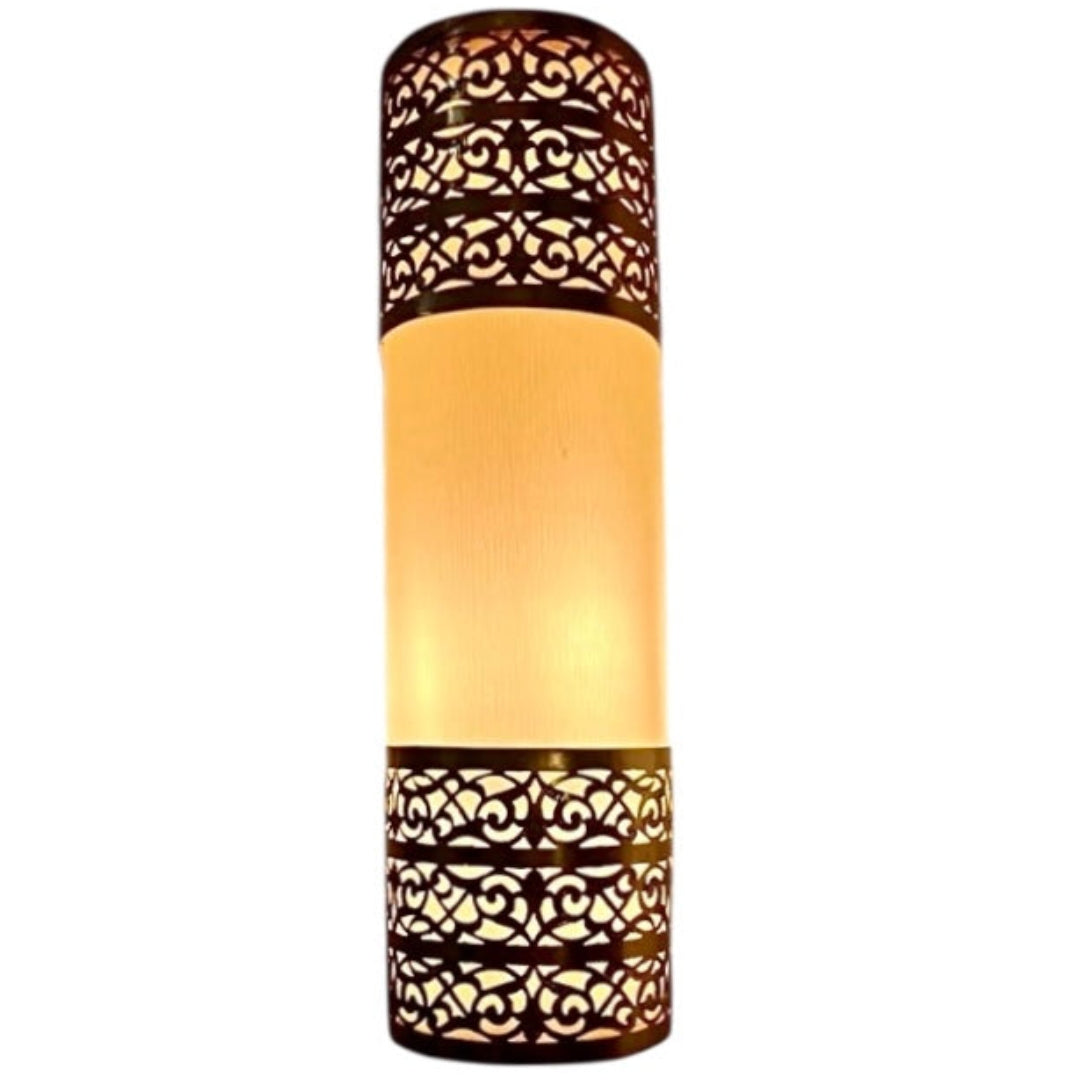 Close-up of the handcrafted brass filigree and scrollwork on a Moroccan wall lamp, showcasing artisanal metalwork and luxury finish.