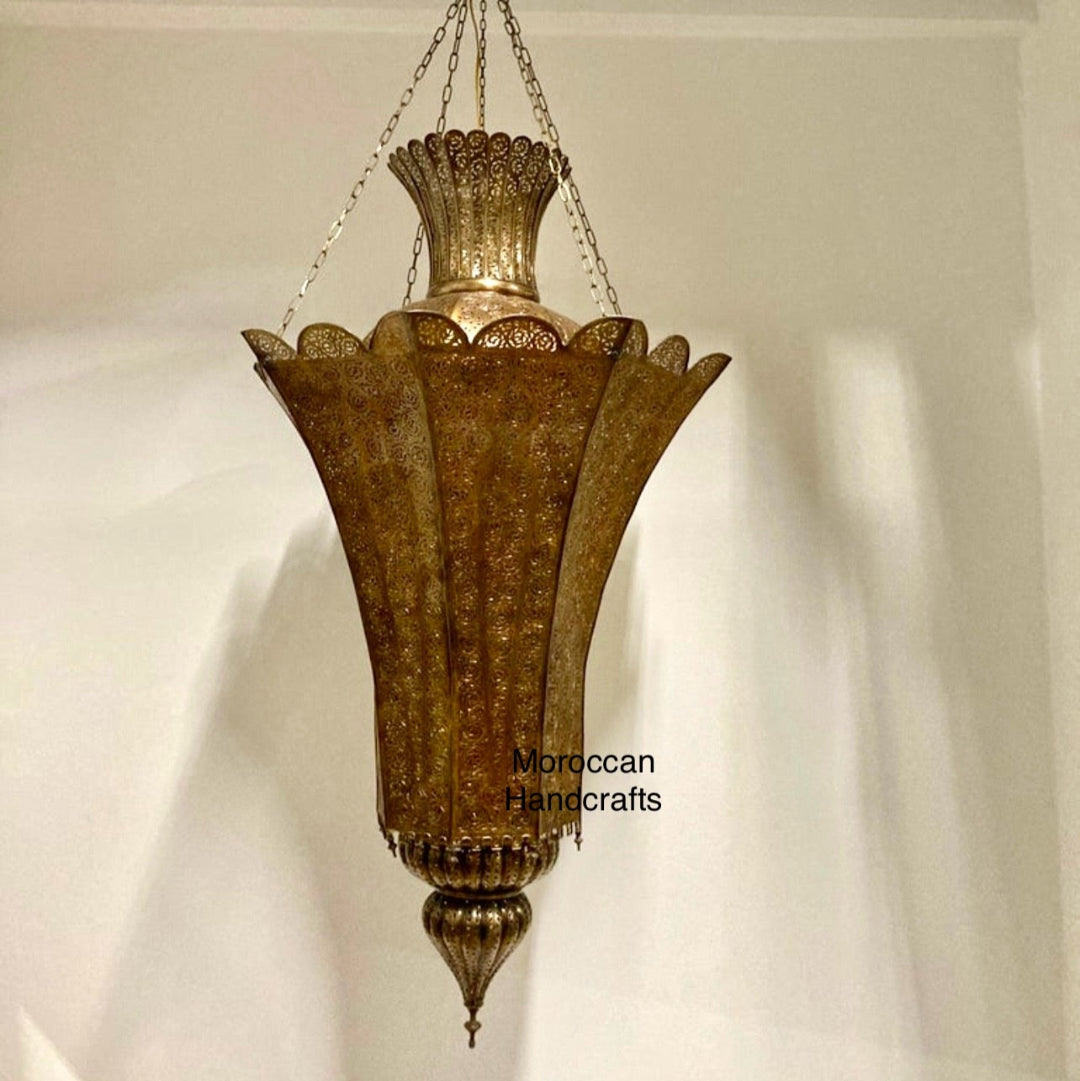 Multi-tiered geometric Moroccan pendant lamp featuring square sections and hand-punched brass metalwork.