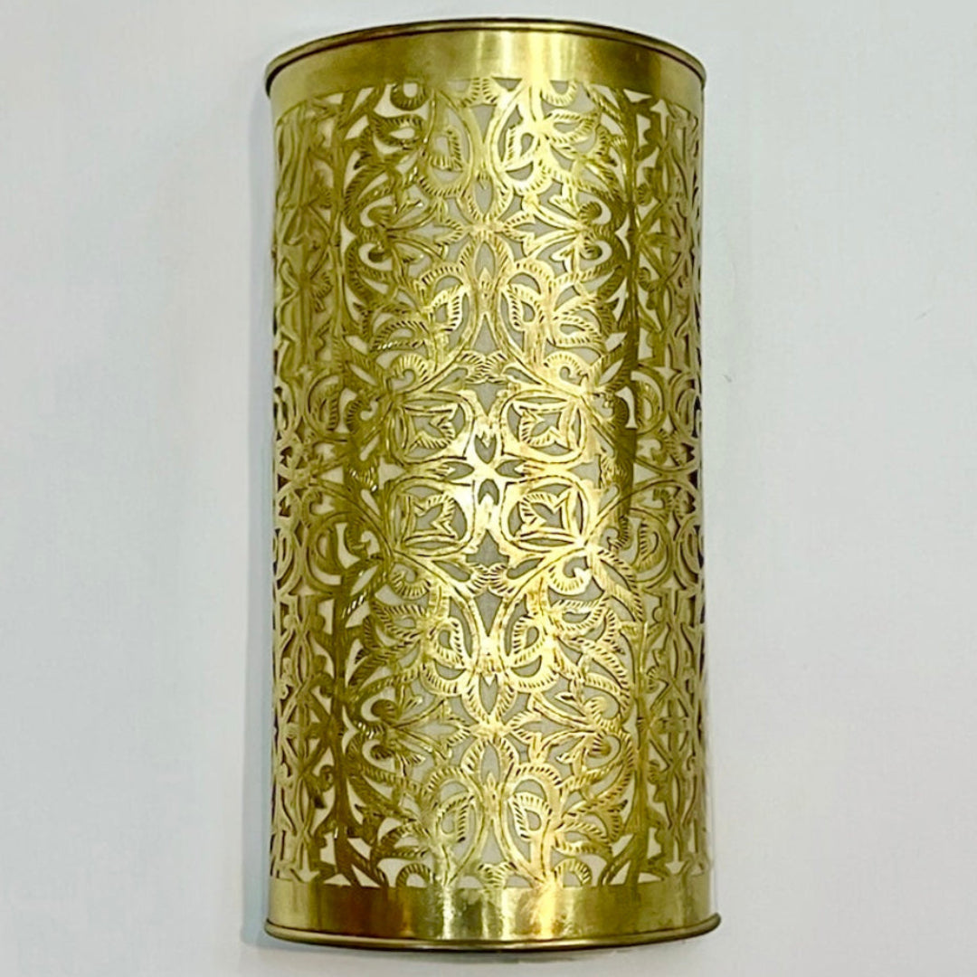 Front view of a premium handmade brass wall sconce featuring detailed Moroccan artisanal carving.