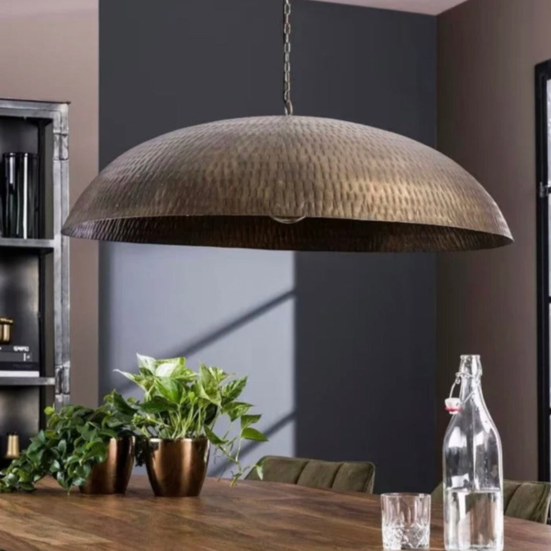 Warm golden glow from an authentic Moroccan brass dome chandelier, handmade by artisans.