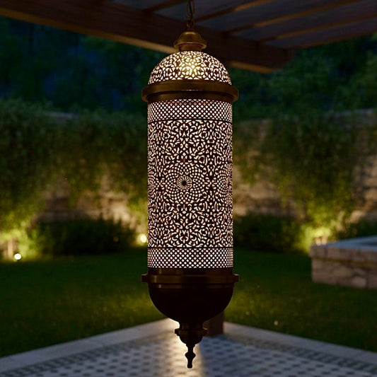 Elegant handcrafted brass Moroccan lantern hanging outdoors on a pergola, providing warm ambient lighting for a garden space.