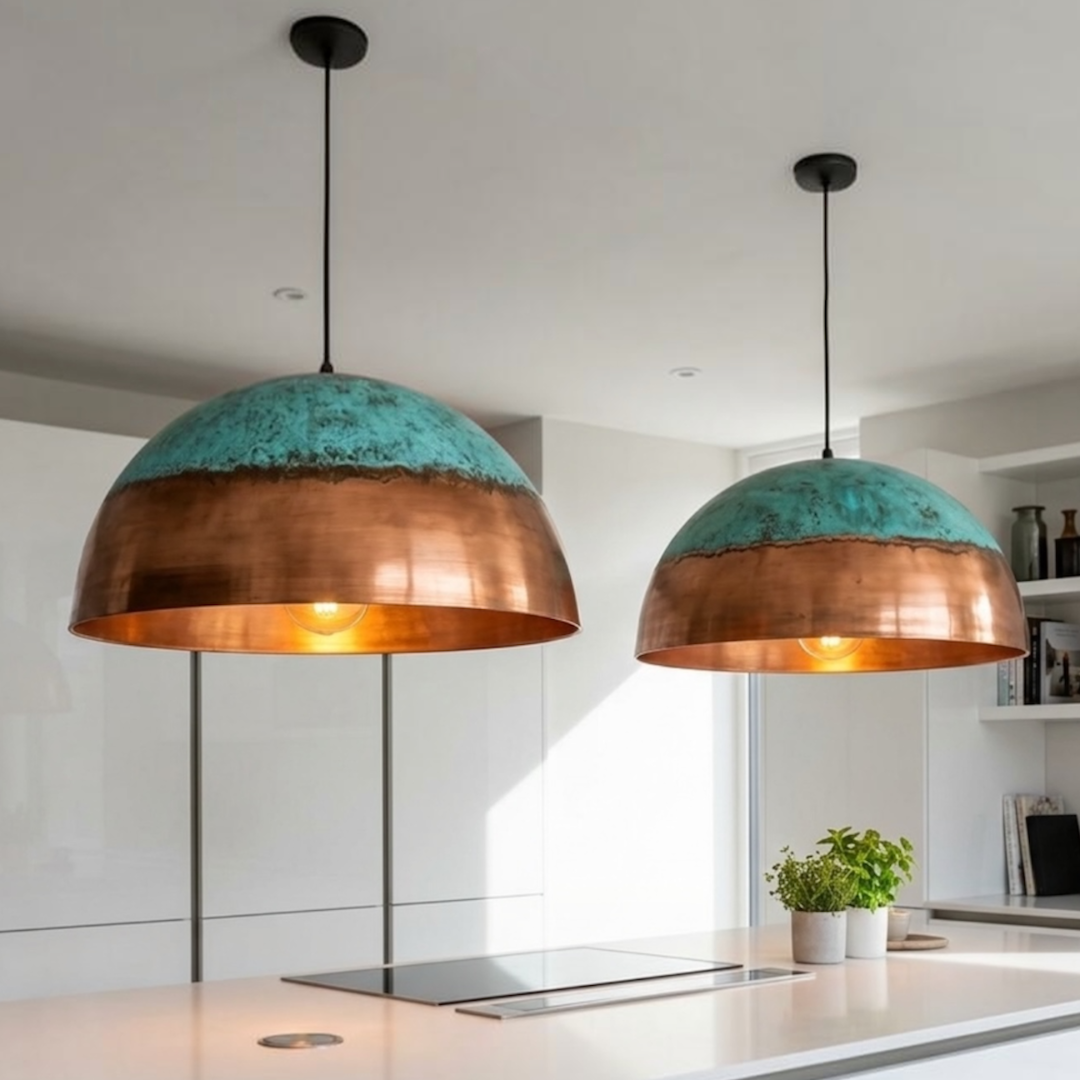  Pair of modern handmade Moroccan brass dome pendant lamps with green patina accent installed above a white marble kitchen island