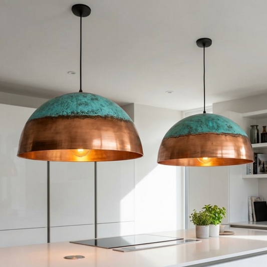  Pair of modern handmade Moroccan brass dome pendant lamps with green patina accent installed above a white marble kitchen island