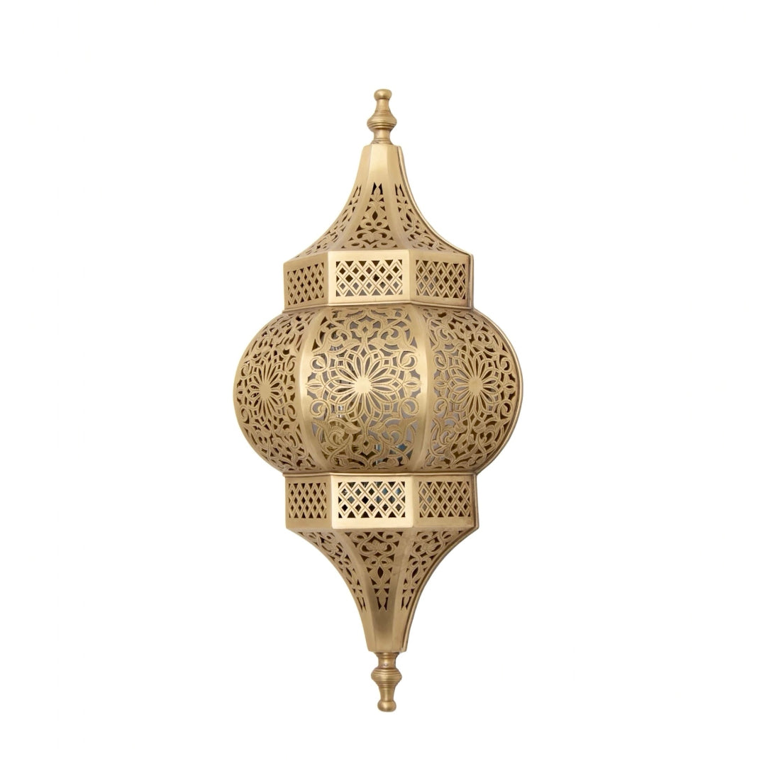  Professional studio shot of a gold-finish handmade brass wall lamp featuring intricate floral geometric cutouts and a symmetrical pointed design.