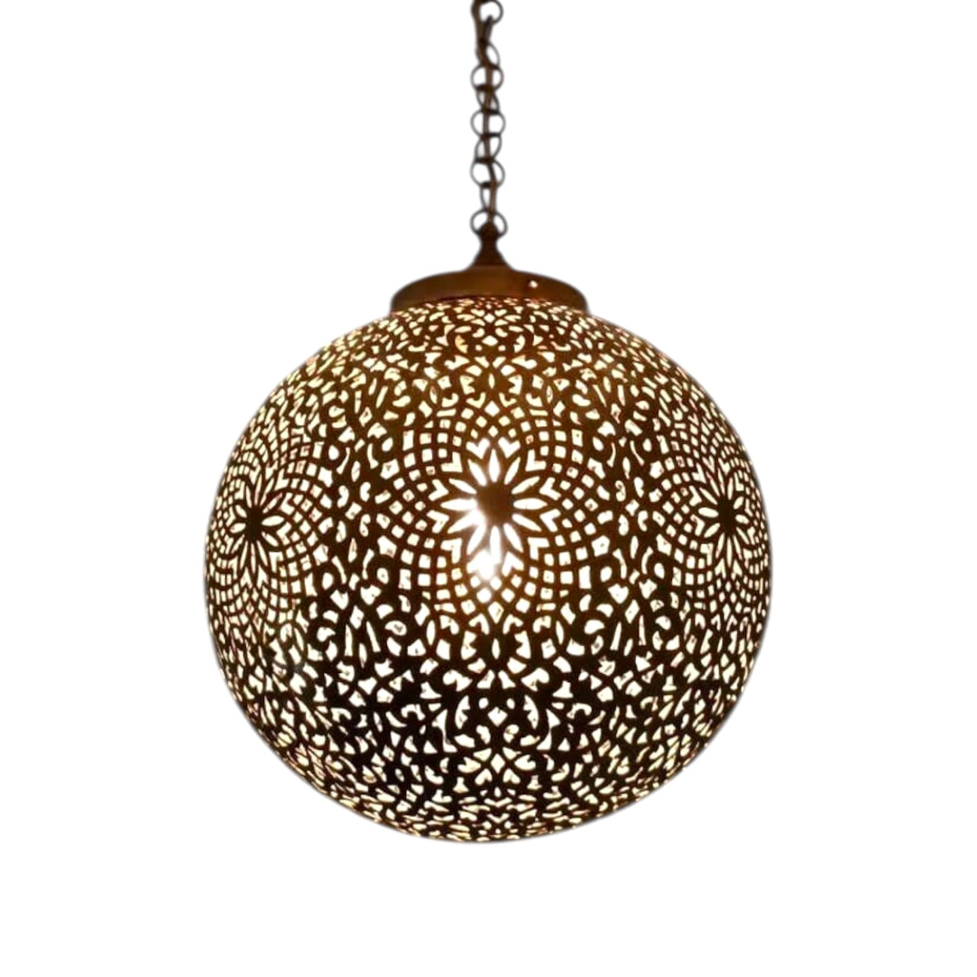  Close-up of a handcrafted Moroccan brass globe lamp featuring intricate geometric filigree patterns on a white background.