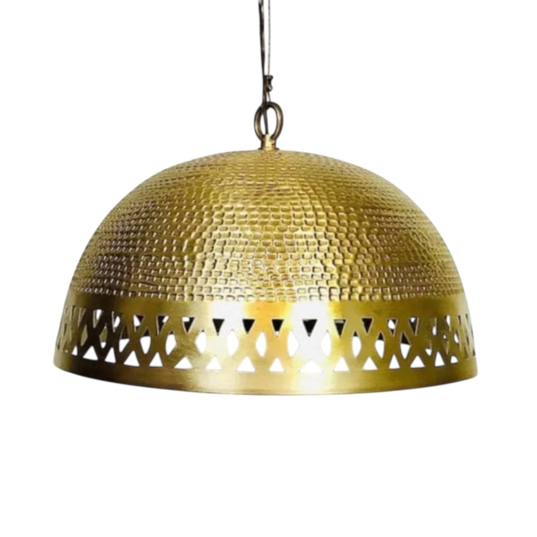 Close-up of a Moroccan dome lamp shade in antique brass featuring a hand-hammered texture and intricate geometric cutout patterns.