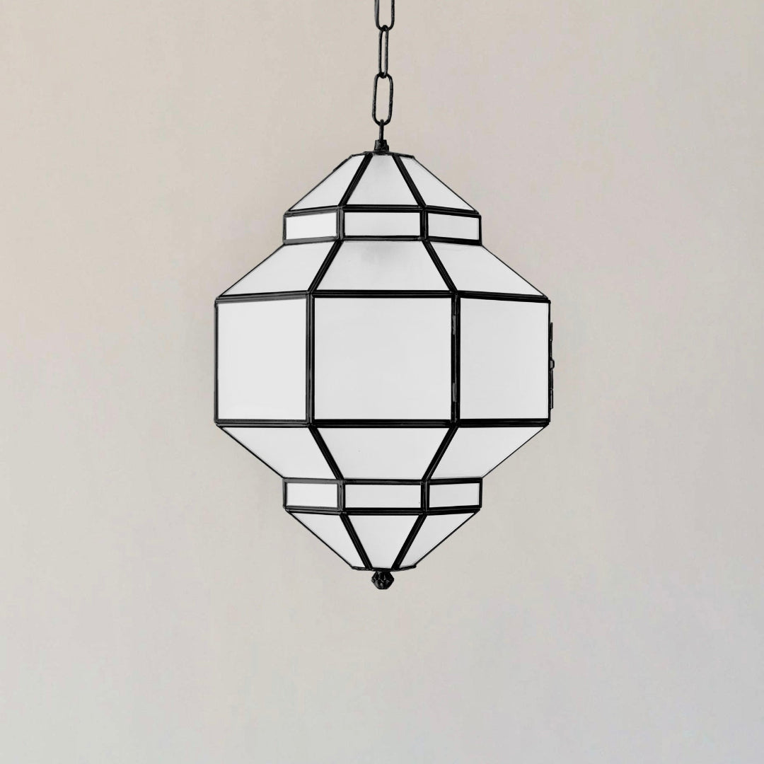  ⁠Handmade geometric Moroccan brass lantern with white frosted glass panels on a neutral studio background.⁠