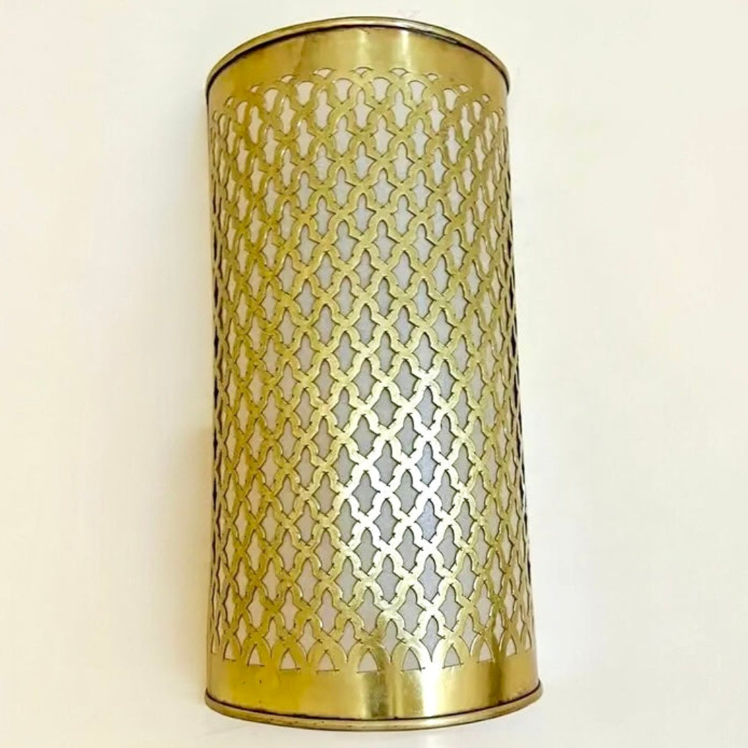 Artisan handmade Moroccan wall light fixture featuring a golden brass exterior and fine geometric latticework for luxury interior decor.